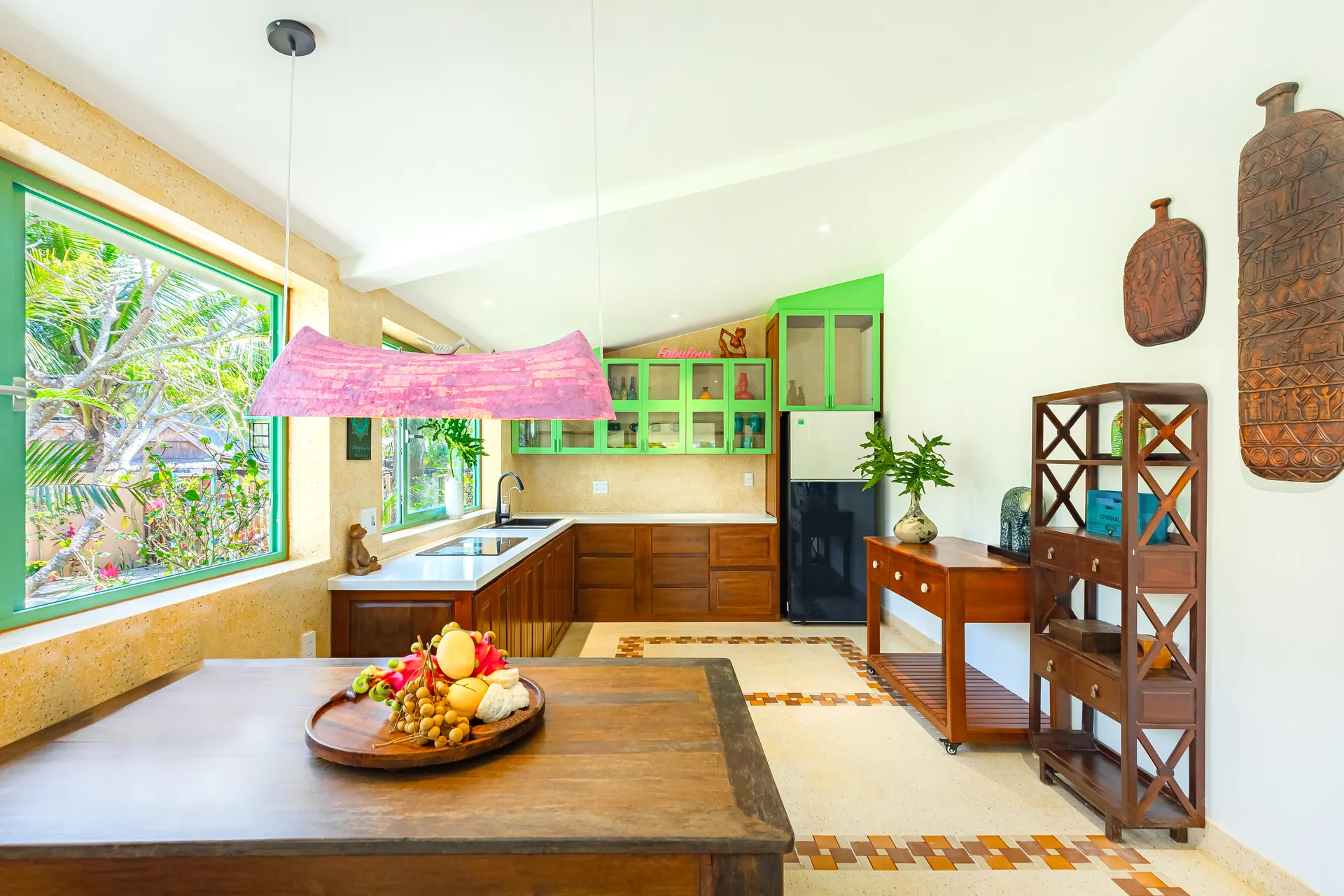 Inside a HÙA Home villa — living room with Vietnamese art